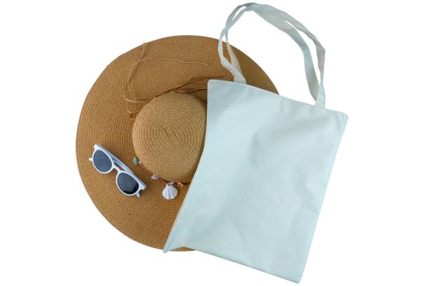 istock Straw Hat, Sunglasses and Tote Bag Isolated on White Background 1604652669