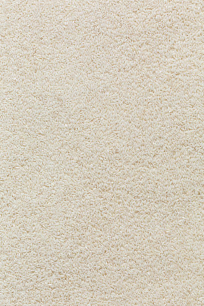 istock Handful of rice on a white background. 1604677071