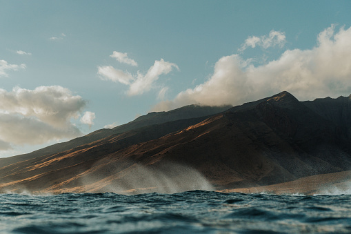 A view from the ocean of Maui’s dramatic coastline