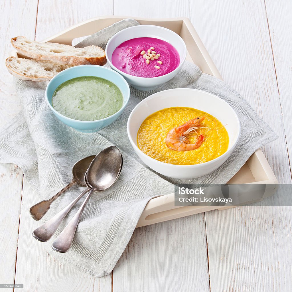 Three colored soup Three colored vegetable soup on a tray Beet Stock Photo