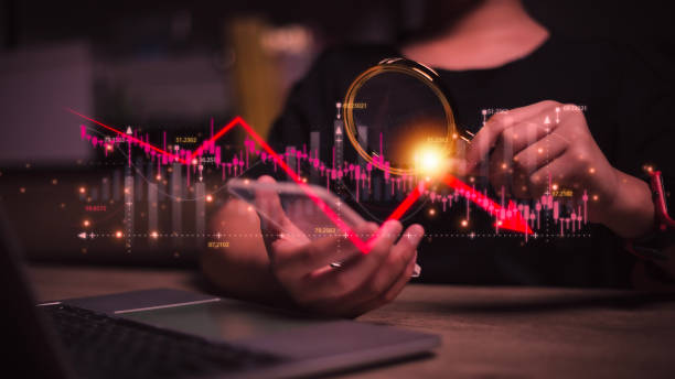 istock Economic crisis, Women analyzing sales data and economic graph chart that is falling due. the stock market crash caused. Economic crisis concept. 1604715258