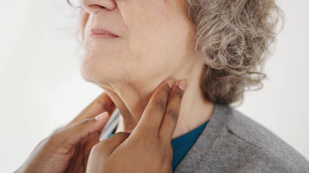 istock Mature woman having a physical exam in a doctor's office 1604725290