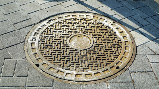 Old Manhole cover on the street floor in Seoul, South Korea