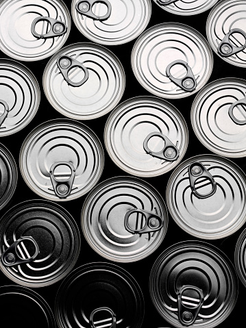 Tin cans all stacked together, overhead view with copy space