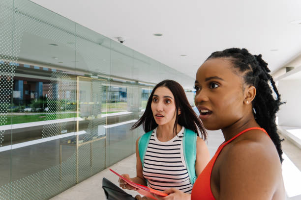 istock Students looking away with expression of surprise in the face 1604735524