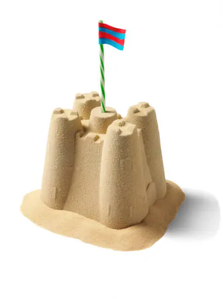 Sandcastle with flag isolated on white with clipping path.
