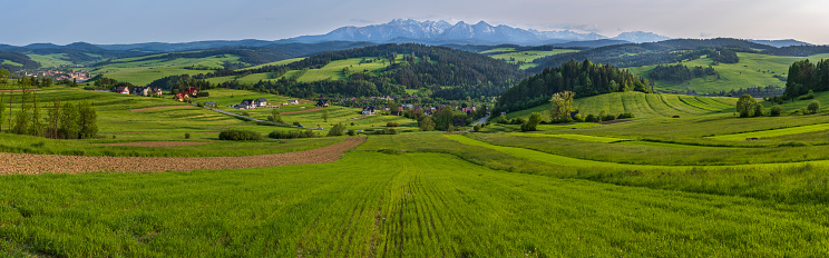 Scenic view of Sromowce Wyzne with the High Tatras in the background, Poland.