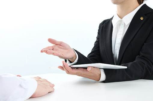 Japanese female lawyer talking with client