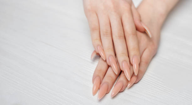 istock Elegant pastel pink natural manicure. 1604757134