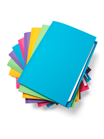 Stack of coloured paper files. Isolated on white, with clipping path