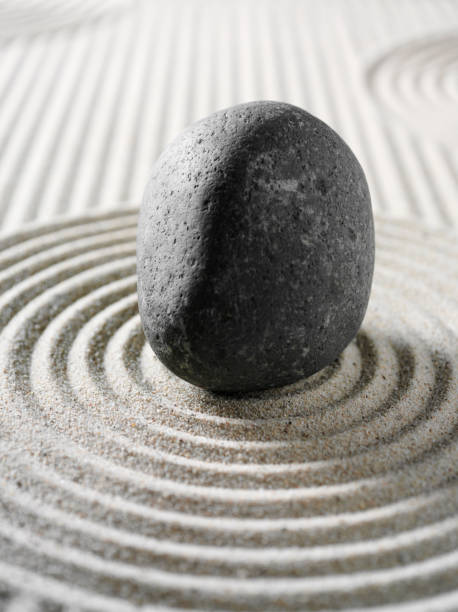 istock Circles in Sand and a Pebble 160476507
