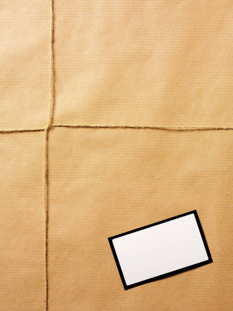 papel pardo parcela amarrado com corda - string package brown paper imagens e fotografias de stock