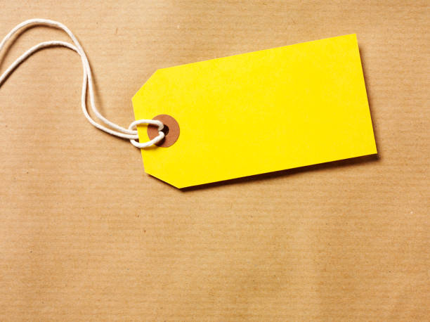 istock Yellow Label and Brown Paper Background 160476908