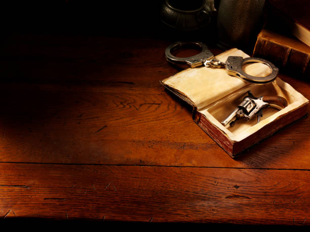 istock Handcuffs and Handgun in Vintage Style 160476937
