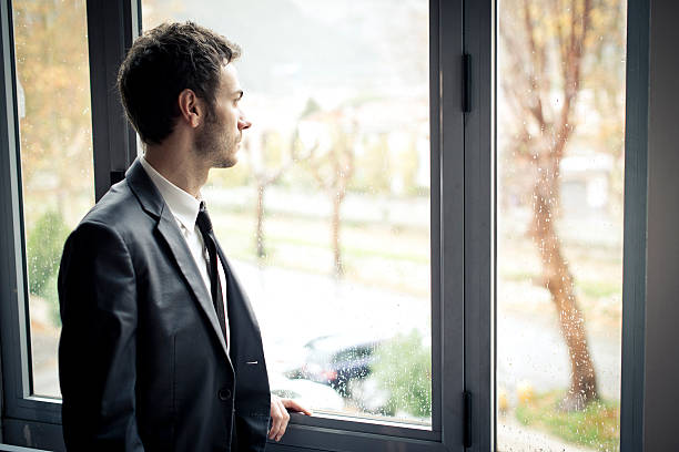 istock Businessman watching outside the window. 160476997