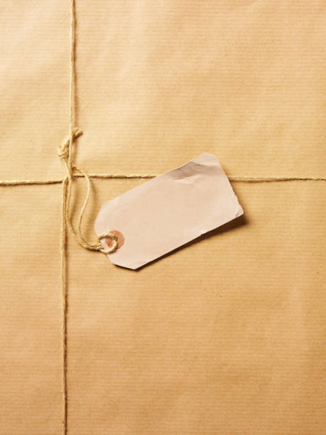 istock Damaged Label on a Brown Paper Parcel 160477101