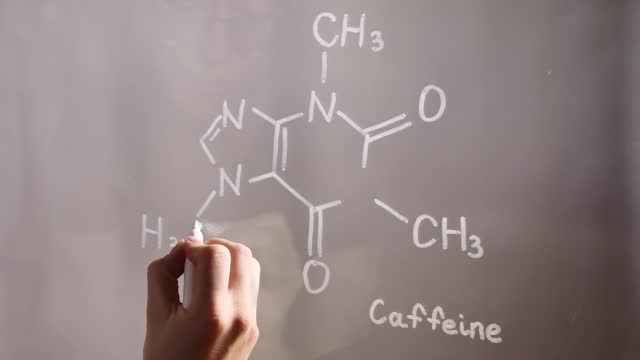 Caffeine formula on glass in the laboratory
