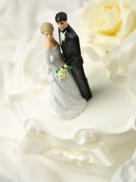 istock Bride and Groom on Top of a Wedding Cake 160478339