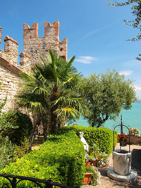 View of a beautiful mediterranean garden in Sirmione, Garda Lake, Italy.