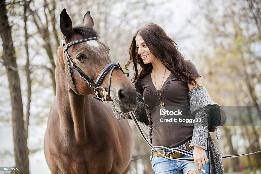 Young woman with a horse Pretty young woman with a horse 20-29 Years Stock Photo