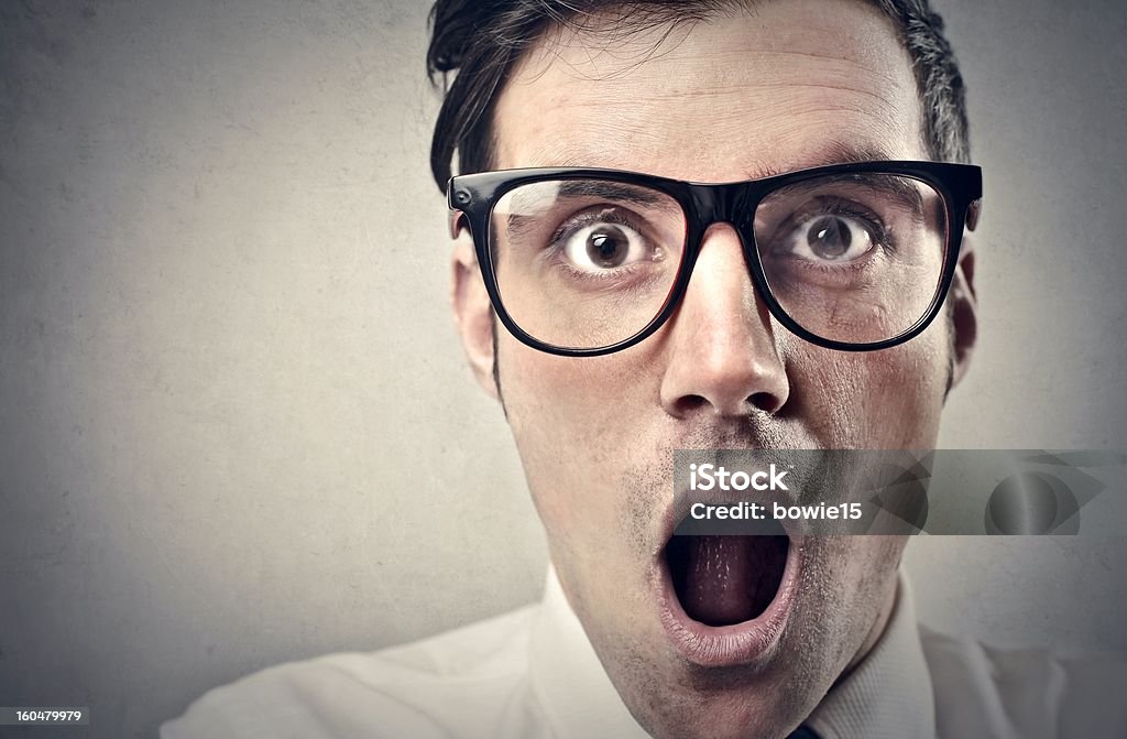 astonishment foreground man who opens his mouth from amazement Adult Stock Photo