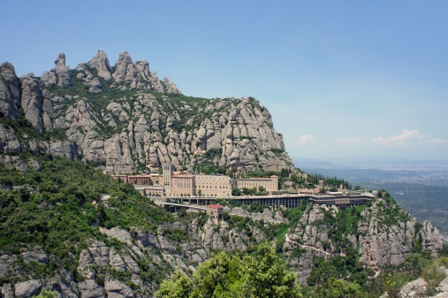 Panoramic view of Montserrat Monastery. Benedictine Abbey high up in the mountains near Barcelona, Catalonia, Spain.