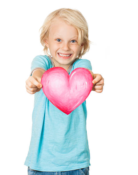 istock Cute young smiling boy holding love heart 160480416