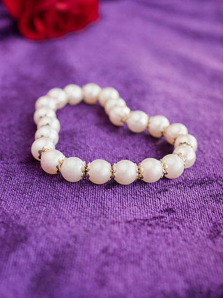 istock Love, pearls, rose, purple velvet. 160480491
