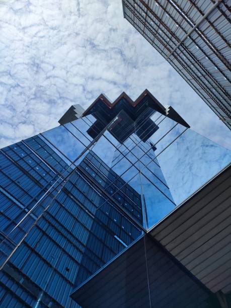 istock the sky as seen from below the blue building 1604806963