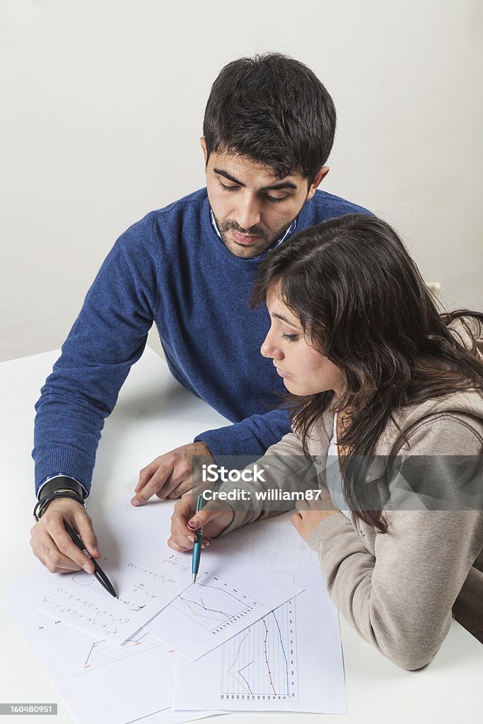 Young Woman Studying with Her Tutor Adult Stock Photo