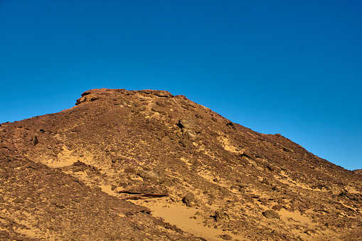 A rock mountain in the desert of Algeria