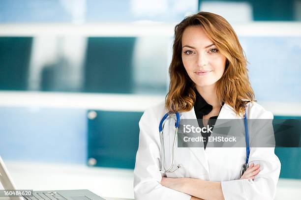 Young Woman Caucasian Doctor Nurse In Healthcare Office Clinic Stock Photo - Download Image Now
