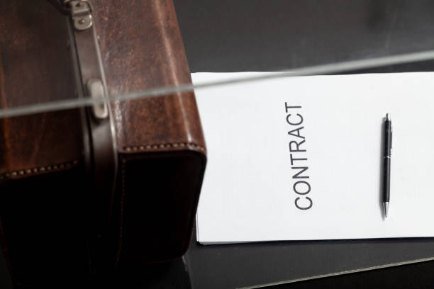 istock Contract and leather carpetbag close-up 1604867396