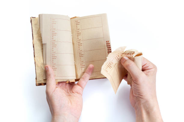 Hands of  man tearing page out of notebook close-up stock photo