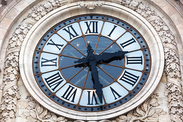 clock of the Orsay museum in Paris old clock on the facade of the museum Orsay in Paris musee dorsay stock pictures, royalty-free photos & images