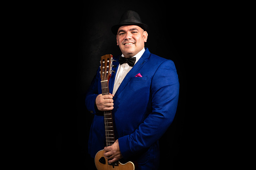 Latin musician on a black background.