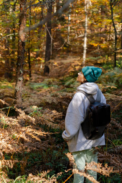 istock Woman traveler with backpack 1604915797