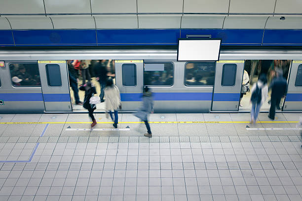 moving people enter carriage at metro station