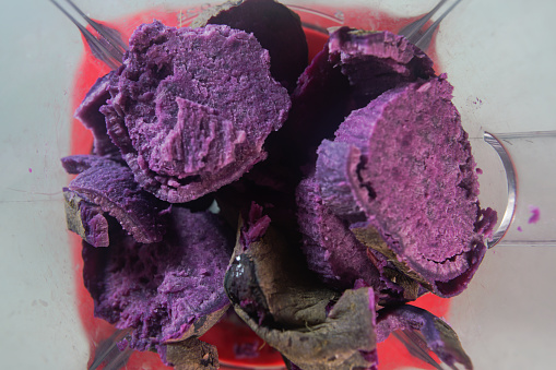 Purple sweet potato in the food processor view from above