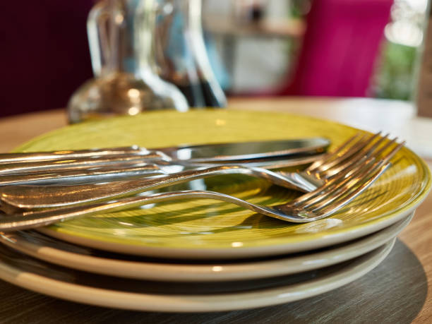 istock On the table is a plate with forks and cutlery. 1604936048
