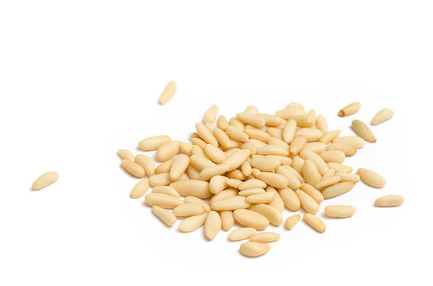 Pine nuts Shelled pine nuts isolated on white background pinion stock pictures, royalty-free photos & images