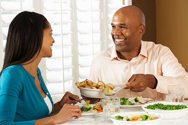 istock Couple Enjoying Meal At Home 160493902