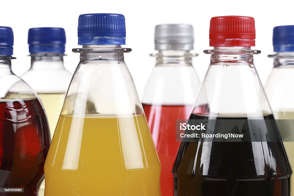 Different bottles with soda Different bottles with soda isolated on white background Soda Bottle Stock Photo