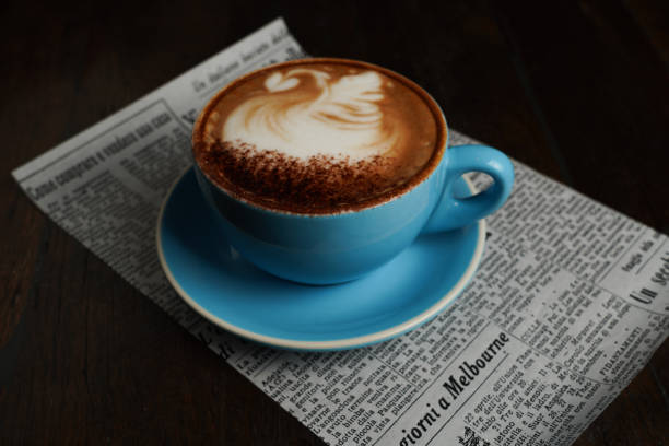istock A coffee in a blue cup on a piece of newspaper 1604944743