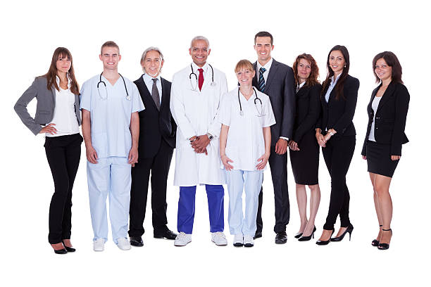 Hospital staff group A happy group photo depicting a group of staff people. Isolated on white healthcare and medicine business hospital variation stock pictures, royalty-free photos & images