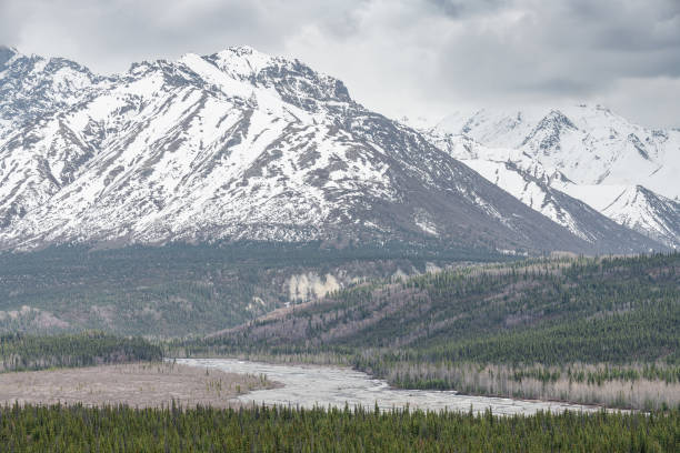 istock Matanuska River with snow covered mountains behind in Alaska, USA 1605008321