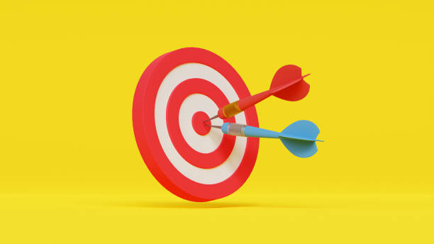 istock Creative illustration of red round shaped target with two darts representing concept of setting goals correctly on yellow background 1605009382