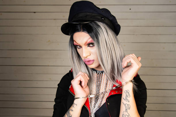 istock Drag queen in a provocative outfit poses in the studio. 1605010456