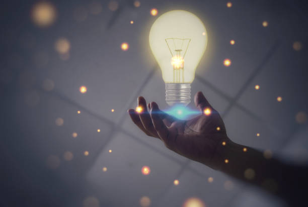 istock The light bulb in hand is like the idea of ​​researching by doing. 1605043749