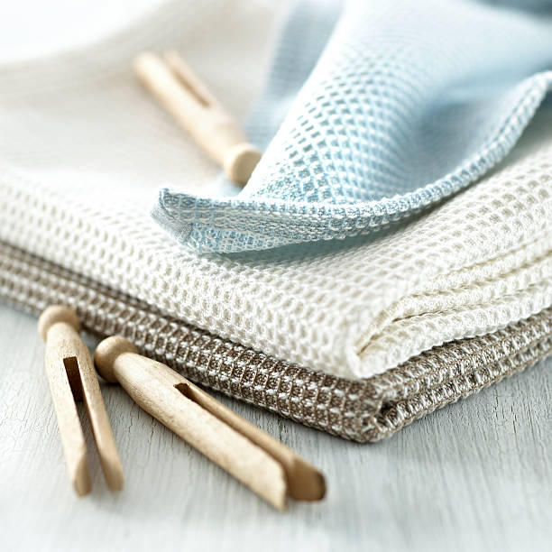 Clothespins on a tea towel stock photo